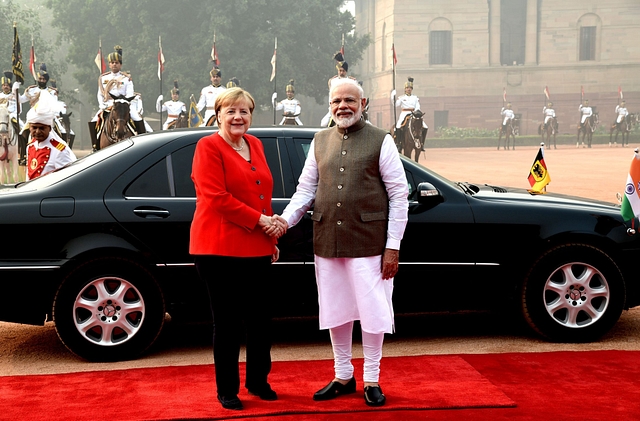 PM Modi with Angela Merkel. (via Twitter)