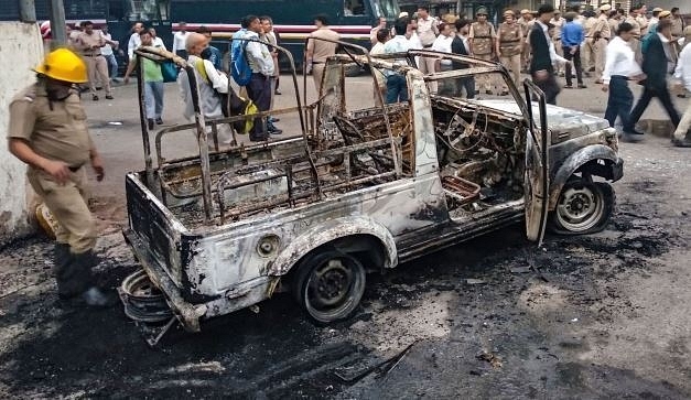 A damaged vehicle due to clashes between Delhi Police and advocates at The Tis Hazari Court (Picture Courtesy: Twitter/@TPE_connect)