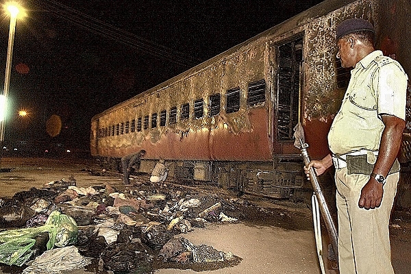 The remains of the Sabarmati Express that was set ablaze (SEBASTIAN D’SOUZA/AFP/Getty Images)