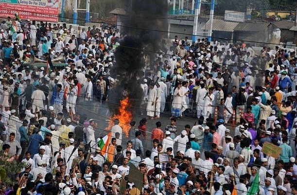 Muslim men taking part in an anti-CAB protest.&nbsp;