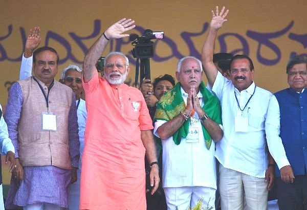  Prime Minister Narendra Modi with Karnataka state BJP president and chief ministerial candidate for upcoming state assembly election, B S Yeddyurappa, Union minister Ananth Kumar, and Sadanand Gowda in Davangere. (Arijit Sen/Hindustan Times via Getty Images)