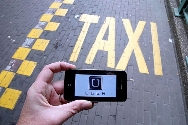 The Uber app. (NICOLAS MAETERLINCK/AFP/GettyImages)