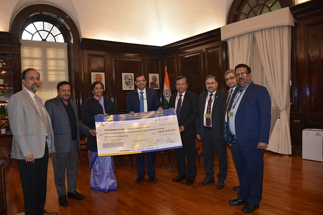 LIC officials handing over the cheque to Finance Minister Nirmala Sitharaman (Pic Via Twitter)