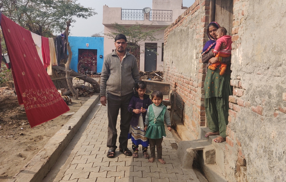 Lokesh with his wife and children at his house in Rabupura village in Uttar’s Pradesh Gautam Budh Nagar district on 9 January
