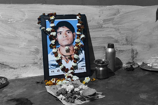 Dhan Prasad Ahirwar’s picture in the room where he was allegedly set on fire by neighbours. Picture clicked on 28 January. (Swati Goel Sharma/Swarajya Magazine)