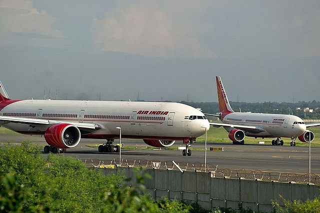 Air India planes prepare for take-off at the Indira Gandhi International Airport in New Delhi. (MANANVATSYAYANA/AFP/GettyImages)