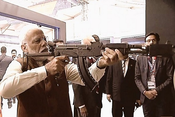 Prime Minister Narendra Modi checking out the virtual firing range at DefExpo 2020 (@livefist/Twitter)