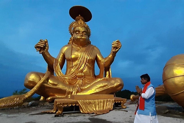 Kailash Vijaywargiya in front of the Hanuman idol.