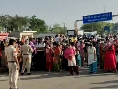 A screen grab from a video in which police was seen stopping the workers.