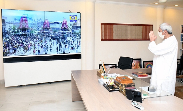 Odisha CM Naveen Patnaik pays obeisances to the deities through video-conferencing, from his office. 