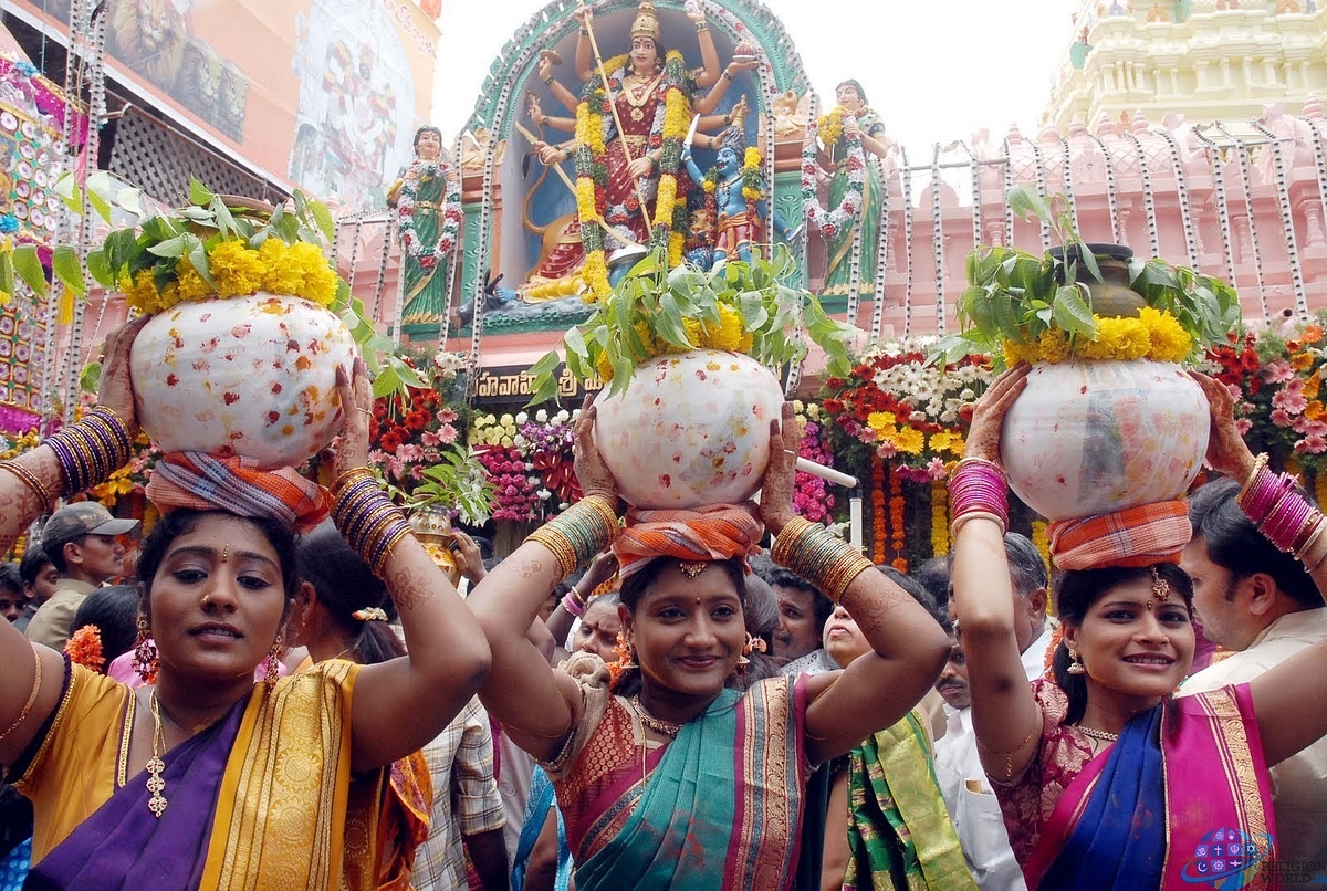 Women carrying the Bonams to be offered to the Goddess 
