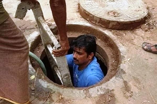 BJP Corporator Enters Manhole To Clean Garbage Filled Drain After Finding No Labourers To Do The Job