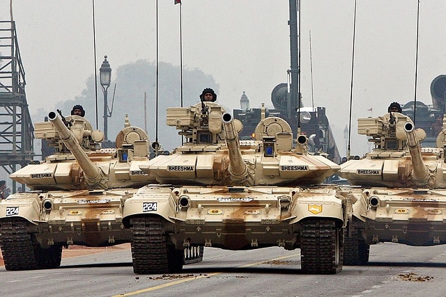 
Indian Army T-90 ‘Bheesma’ tanks roll through Janpath during 
rehearsals for the Indian Republic Day parade in New Delhi. (Photo Credit: RAVEENDRAN/AFP/Getty Images)

