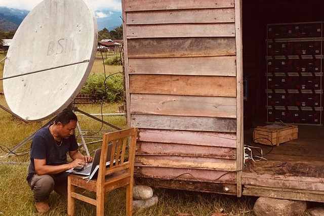 BSNL engineer Karma Tshering outside the log hut at Vijoynagar that houses the sophisticated equipment. (newsfileonline)