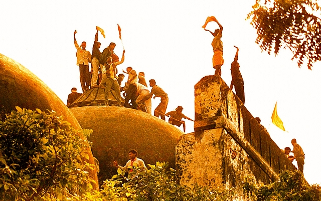 Hindu youth demolishing Babri Masjid.