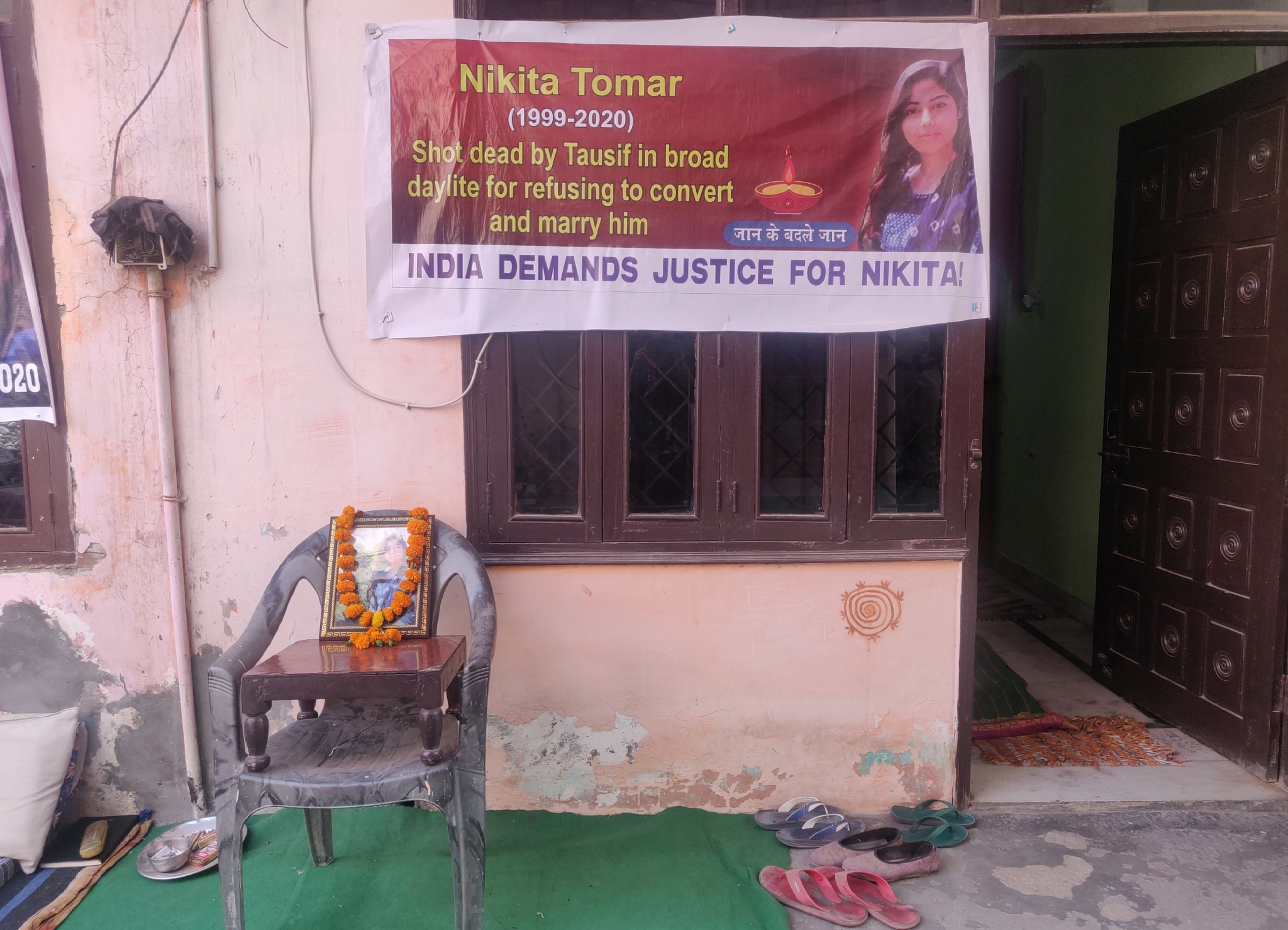 The banner outside the gate of Nikita Tomar’s house on 3 November&nbsp;