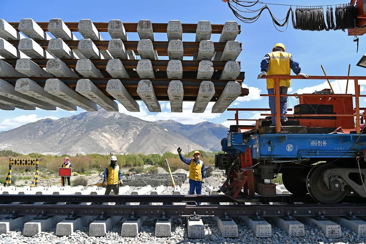  Workers deliver new railroad ties for Sichuan-Tibet railway in Dranang, the Tibet autonomous region, in June. (Xinhua) &nbsp;