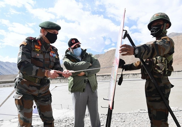 Lieutenant General YK Joshi briefing Prime Minister Narendra Modi.