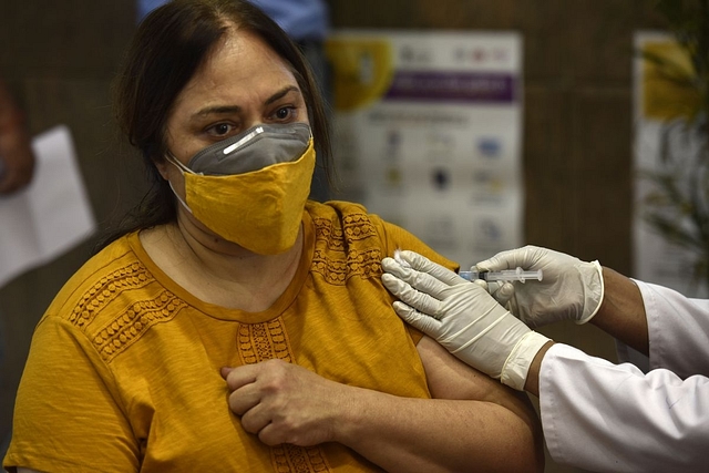 A woman getting vaccinated