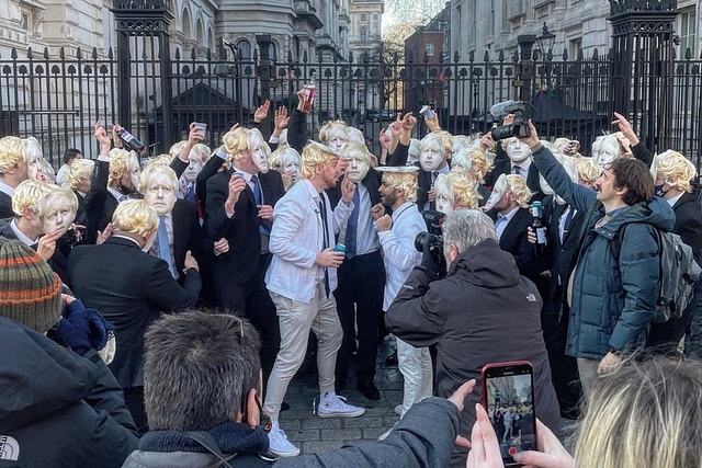 Protestors outside 10 Downing Street, dressed up as Boris Johnson 