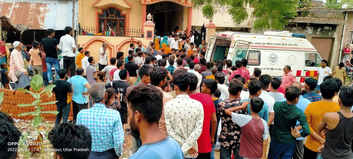 Crowd outside the victims’ house on 28 June