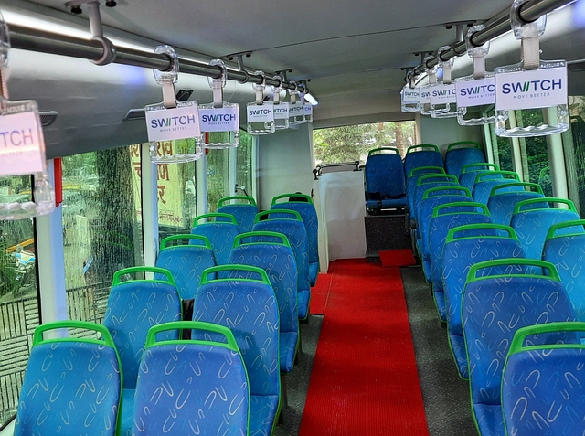 Interiors of the second level of electric double decker with stairs visible at the back (@turbochargedmag/Twitter)
