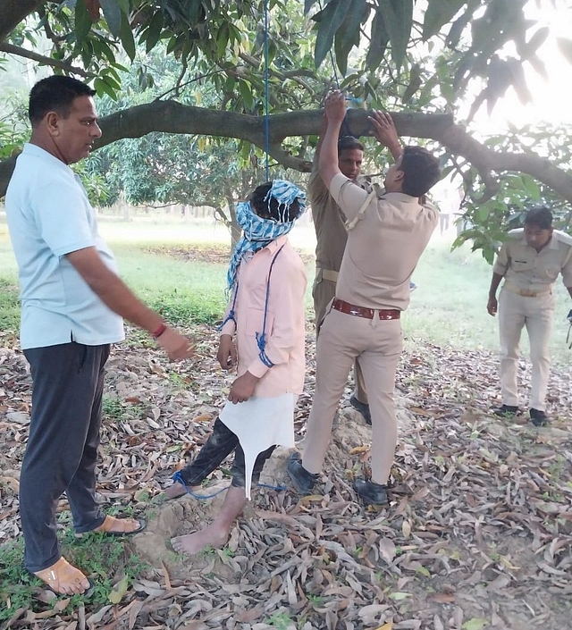Police bringing down Sunil's body on Saturday morning.