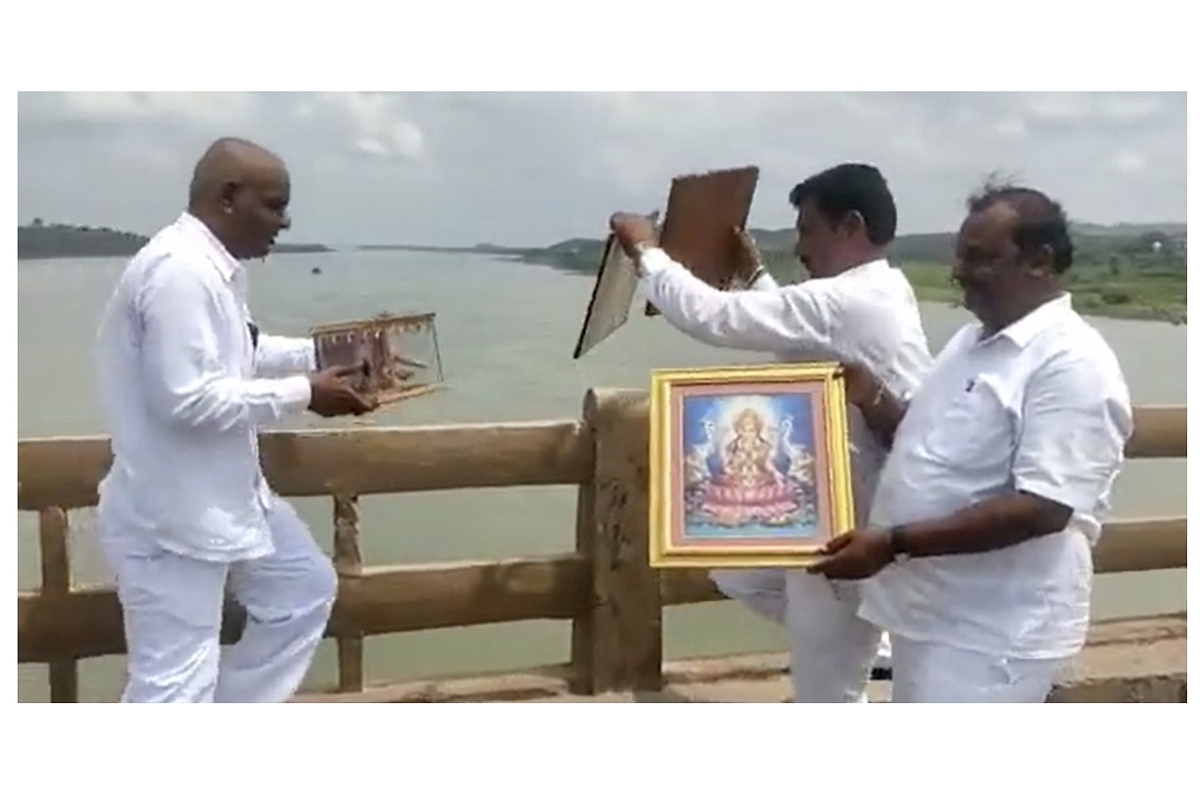 Scheduled Community leaders throwing Hindu Gods and Goddesses into river. 