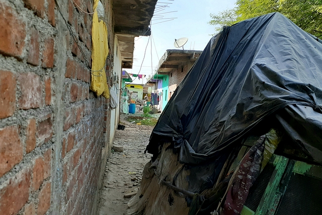 The narrow passage leading to Gond houses built under Pradhan Mantri Awas scheme.