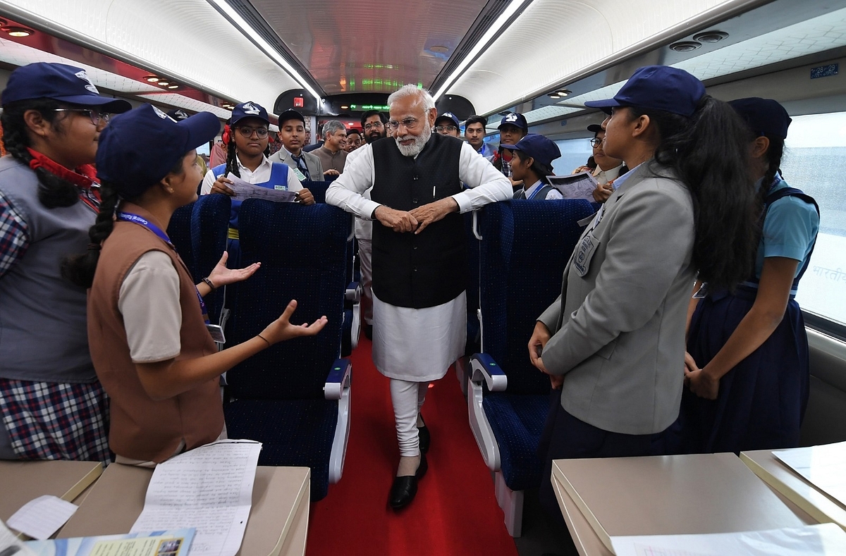 Prime Minister Narendra Modi interacting with school kids on the newly launched Mumbai-Sainagar Shirdi Vande Bharat Express.