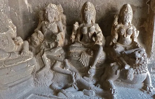 Durgā, at right with lion, another goddess at center, and Kāla at left