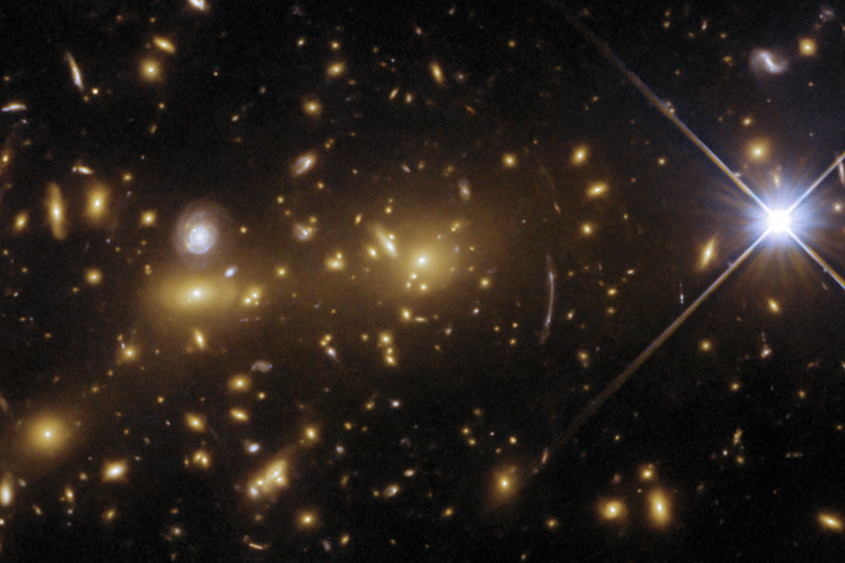 Making Of A Cosmic Monster: Hubble Space Telescope Observes Merging Of Galaxy Clusters To Form Gravitational Lens