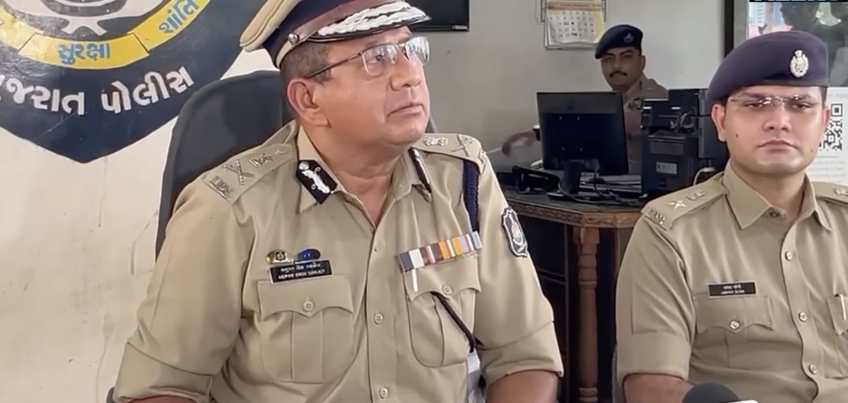 Vadodara police holding a press conference. On the left in the picture is Anupam Singh Gehlot 