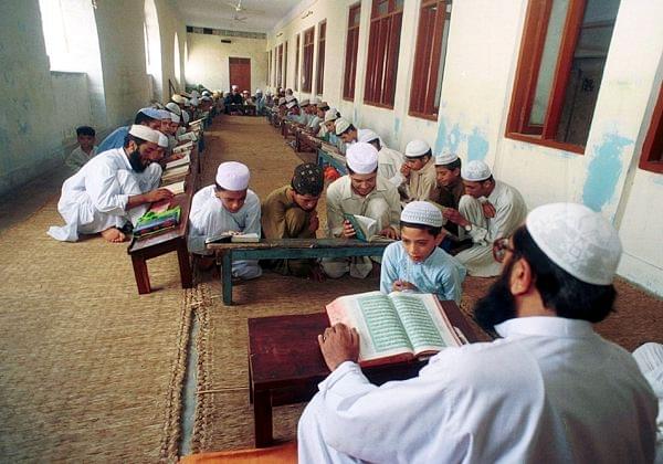 Students recite line at a Madrasa in Pakistan. Photo Credit: <a href="http://www.quazoo.com/q/Madrassas%20in%20Pakistan" shape="rect">Quazoo</a>