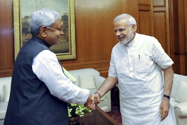 Nitish Kumar with Modi (AFP PHOTO/PIB)