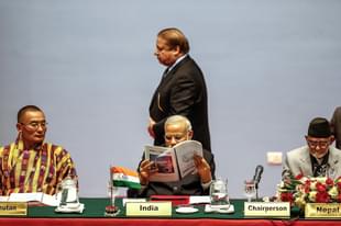 Pakistani Prime Minister Nawaz Sharf walks past Prime Minister Narendra Modi during an earlier SAARC meeting
