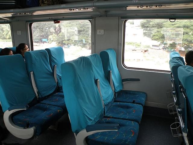 Air-conditioned Chair Car (CC) coaches in an Ganadevta Express.