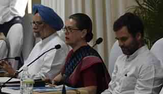 Congress President Sonia Gandhi (C), former Prime Minister Manmohan Singh (L) and Congress Vice President Rahul Gandhi (PRAKASH SINGH/AFP/Getty Images)