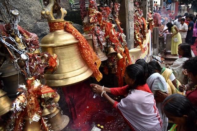 Women worshipping in a Hindu temple