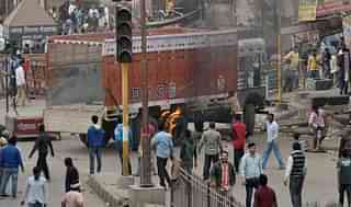 Jat protesters burning a truck (Getty Images)