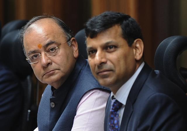 Indian finance minister Arun Jaitely (2L) along with Reserve Bank of India (RBI) governor Raghuram Rajan (3L) look on ahead of a meeting with the Central Board of Directors of the Reserve Bank of India in New Delhi on August 10, 2014. India's central bank governor Raghuram Rajan has defended his recent decision to keep the interest rates unchanged, reassuring  that the current policy will bring down the spiralling inflation. Rajan addressed a meeting of the central board of the Reserve Bank of India (RBI) in New Delhi, which met with the finance minister Arun Jaitley for the first time after he presented the maiden budget of his right-wing government in July.   AFP PHOTO/ SAJJAD HUSSAIN        (Photo credit should read SAJJAD HUSSAIN/AFP/Getty Images)