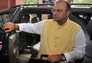 India's Finance Minister Arun Jaitley arrives at parliament to present his budget in New Delhi on July 10, 2014. India's new right-wing government under Prime Minister Narendra Modi unveiled its maiden budget on July 10, promising a new era of fiscal prudence and greater opportunities for foreign investors in key sectors of the economy.      AFP PHOTO / RAVEENDRAN        (Photo credit should read RAVEENDRAN/AFP/Getty Images)
