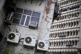AC units line a side of a building in New Delhi (ROBERTO SCHMIDT/AFP/GettyImages)