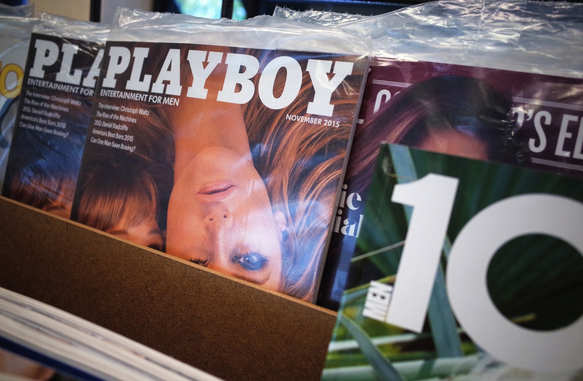November 2015 issues of Playboy magazine are seen on the shelf of a bookstore in Bethesda, Maryland on October 13, 2015. Playboy said Tuesday it will stop publishing nude photos in its iconic magazine for men, throwing in the towel in the face of rampant online pornography. AFP PHOTO/MANDEL NGAN        (Photo credit should read MANDEL NGAN/AFP/Getty Images)