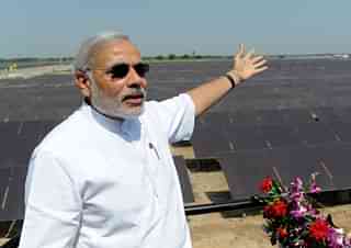 Modi at a solar power farm.