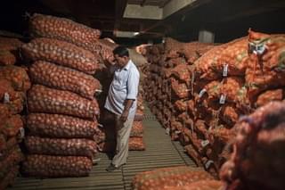 A supervisor inspects sacks of potatoes stacked inside a cold storage unit at the Fryo Foods Pvt factory in Meerut, Uttar Pradesh. (Prashanth Vishwanathan/Bloomberg via Getty Images)