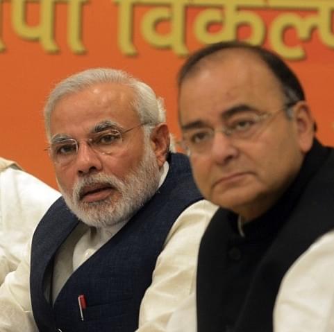 Prime Minister Narendra Modi (L) and Finance Minister, Arun Jaitley (Credits: AFP PHOTO/RAVEENDRAN)