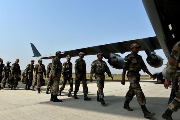 Indian army personnel boarding aircraft heading to Nepal. (Credits: AFP PHOTO / Chandan KHANNA)