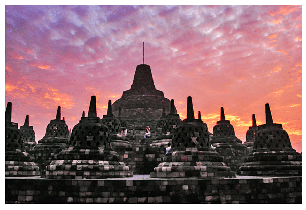 Top of Borobudur - few of the 72 perforated Stupas at sunrise