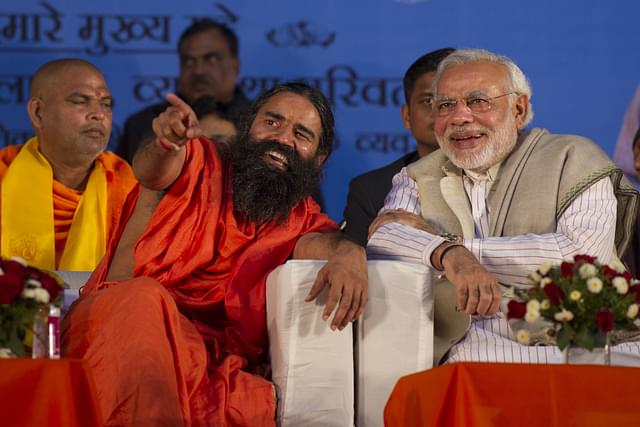 Baba Ramdev with Prime Minister Narendra Modi. (SAJJAD HUSSAIN/AFP/Getty Images)